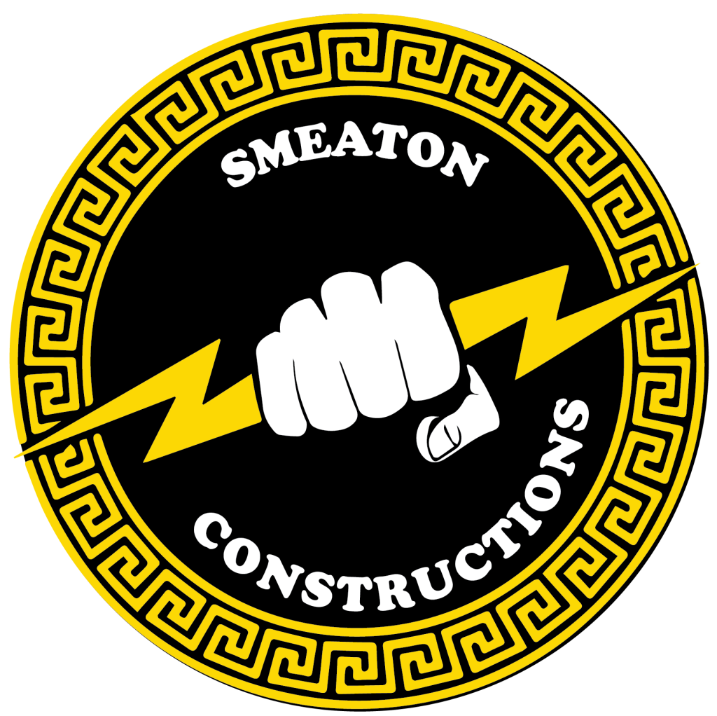 Engineers discussing building plans at a Smeaton Constructions site in Uganda