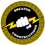 Engineers discussing building plans at a Smeaton Constructions site in Uganda