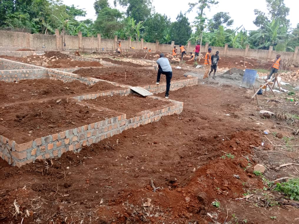 Workers and engineers at a construction site in Namugongo, Uganda