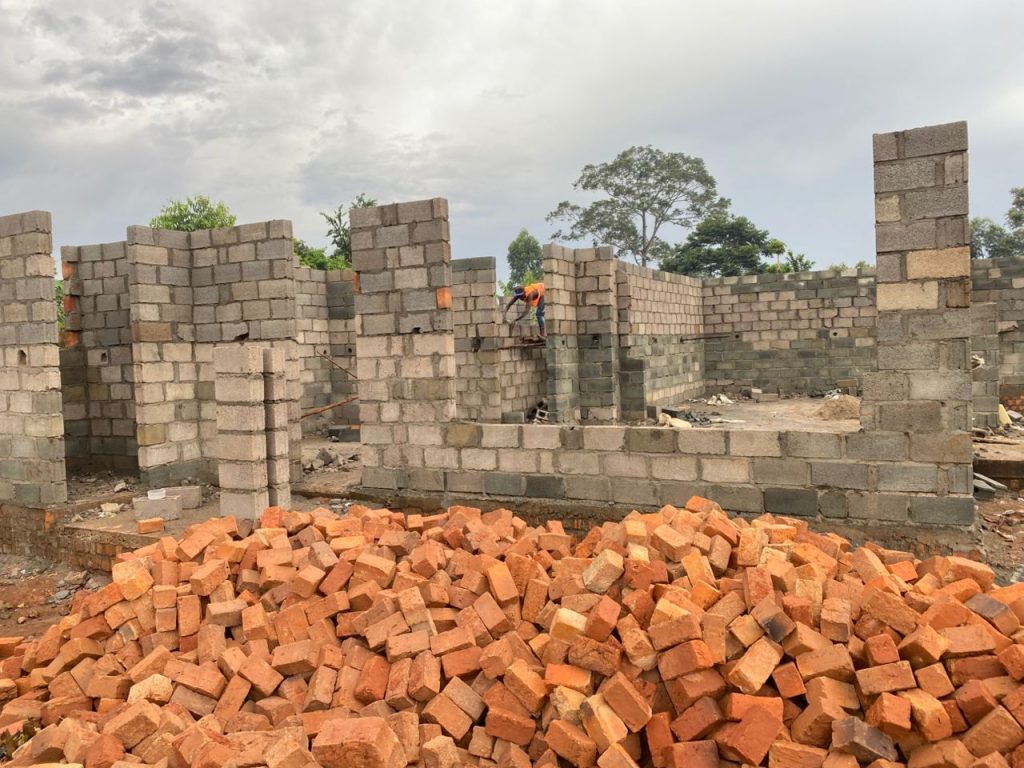 Skilled construction workers building homes in Lubowa Kampala
