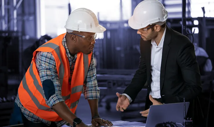 Construction workers and engineers working on a site in Uganda