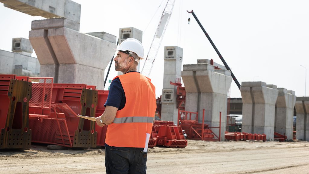Engineer overseeing a construction site in Uganda under Smeaton Constructions.