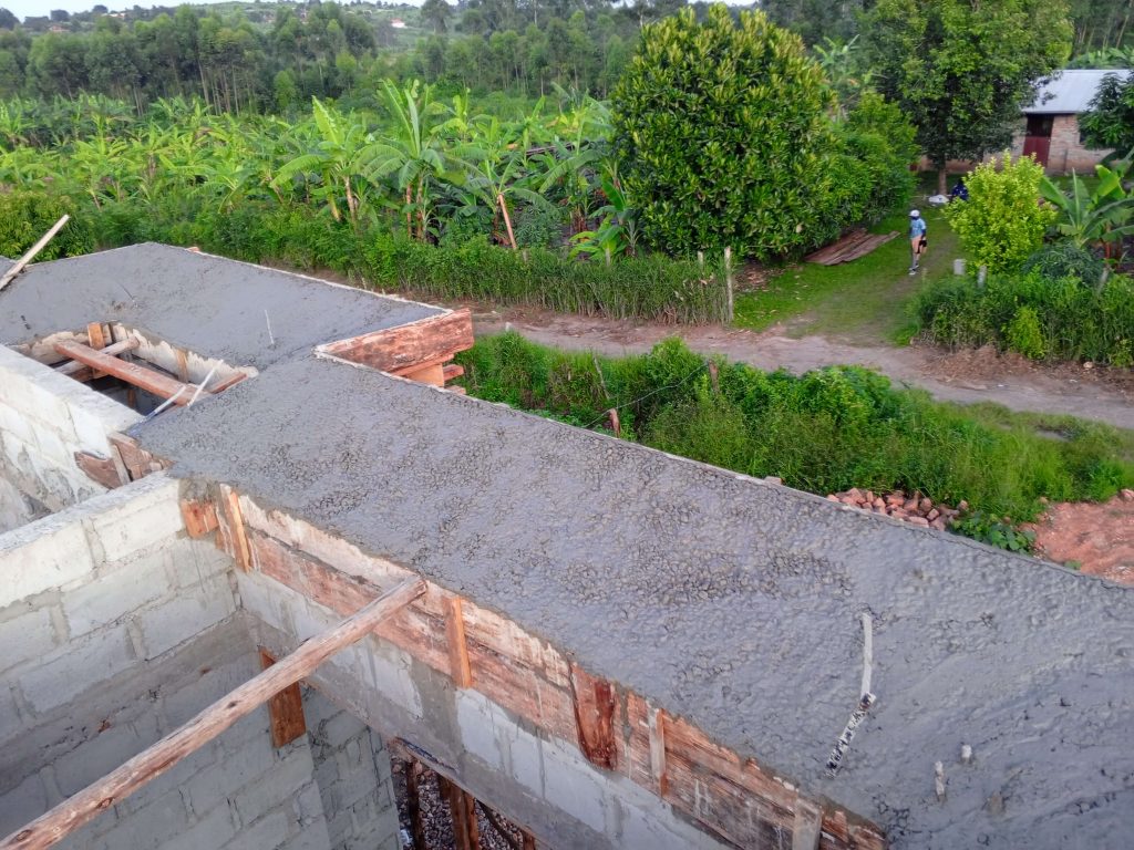 Construction workers and engineers on duty at a Kampala building site.