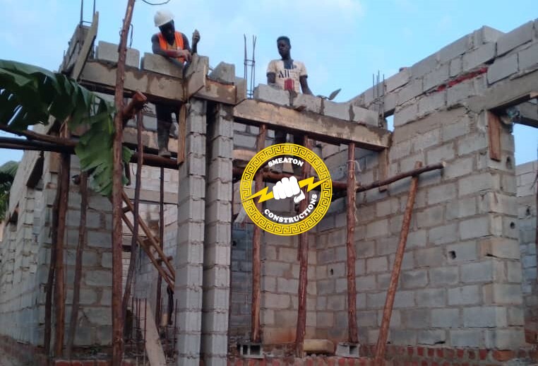 Construction workers at a building site in Uganda