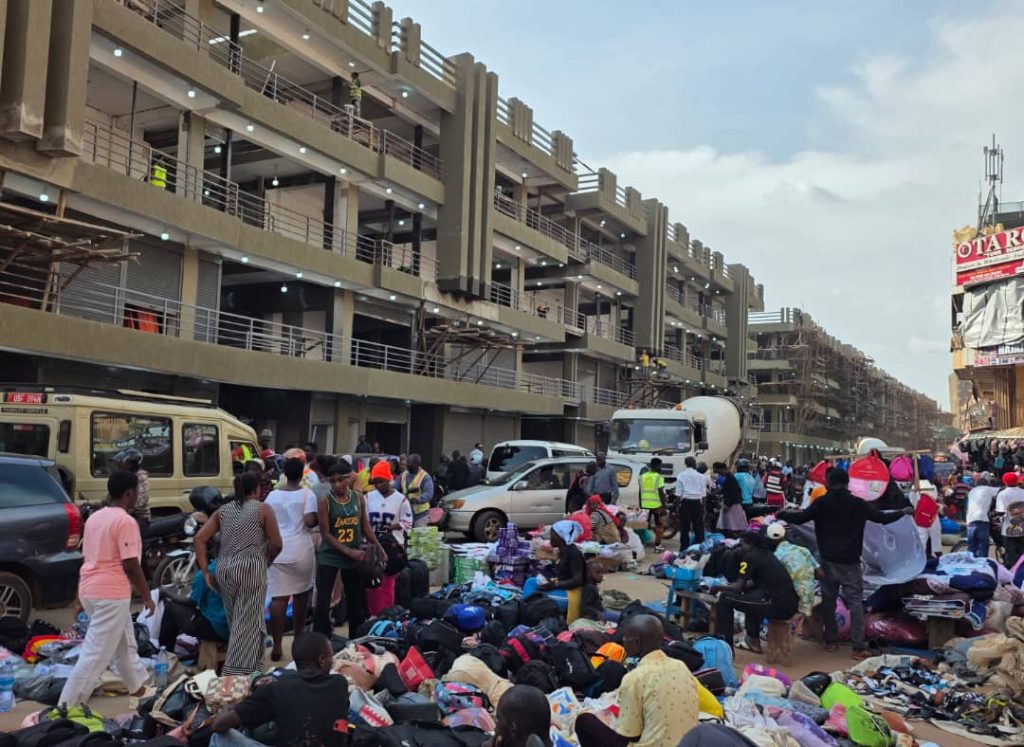Nakivubo Channel upgrade showing new multi storey commercial buildings and active market area in Kampala