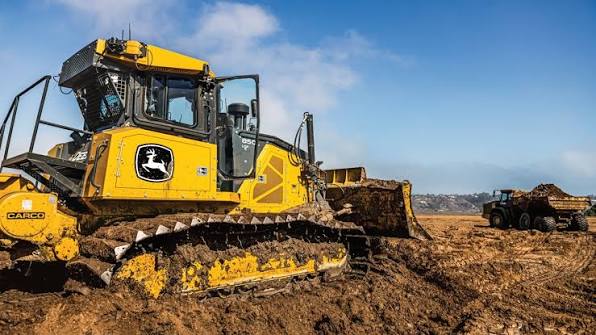 Heavy construction equipment improving productivity on a Ugandan construction site