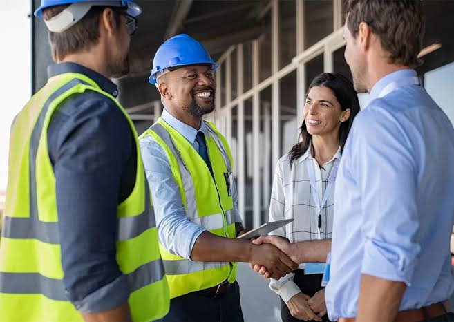 Construction professionals planning a successful building project in Uganda